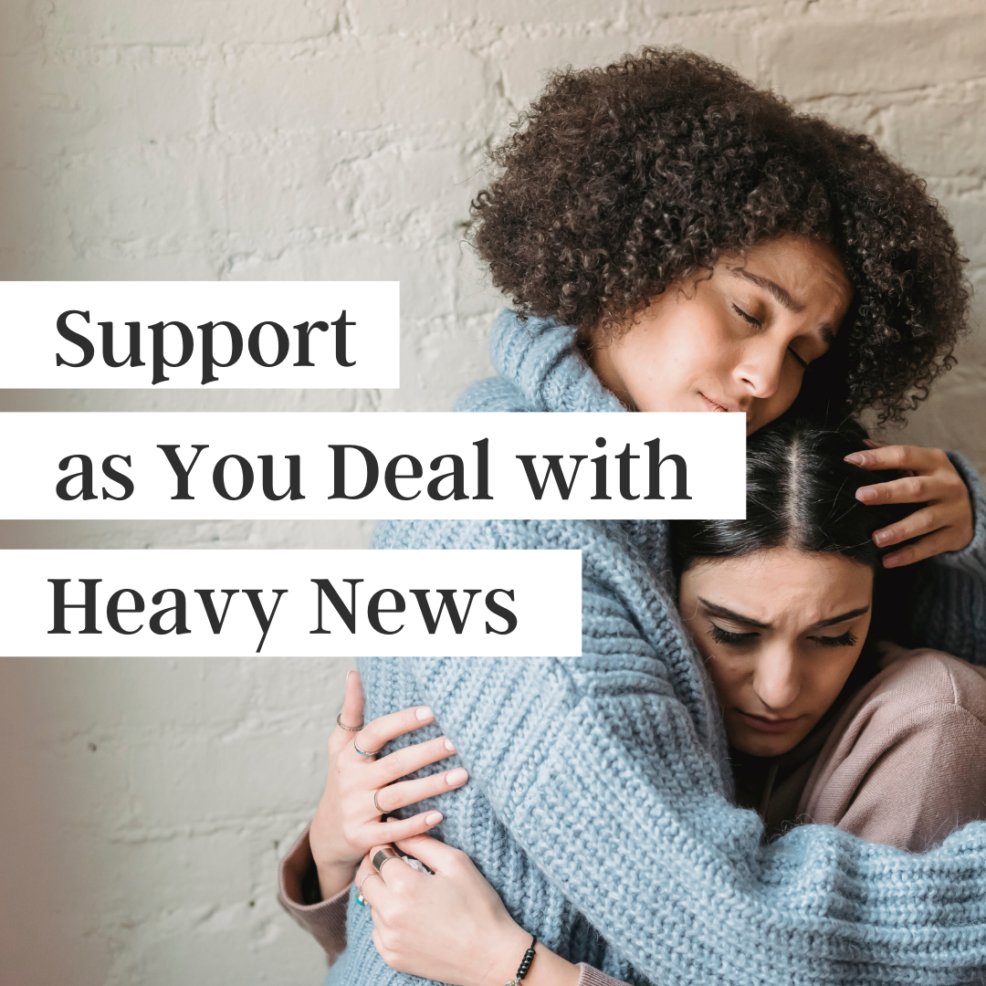 Support as you deal with heavy news written over an image of two women—one black, one white—hugging each other