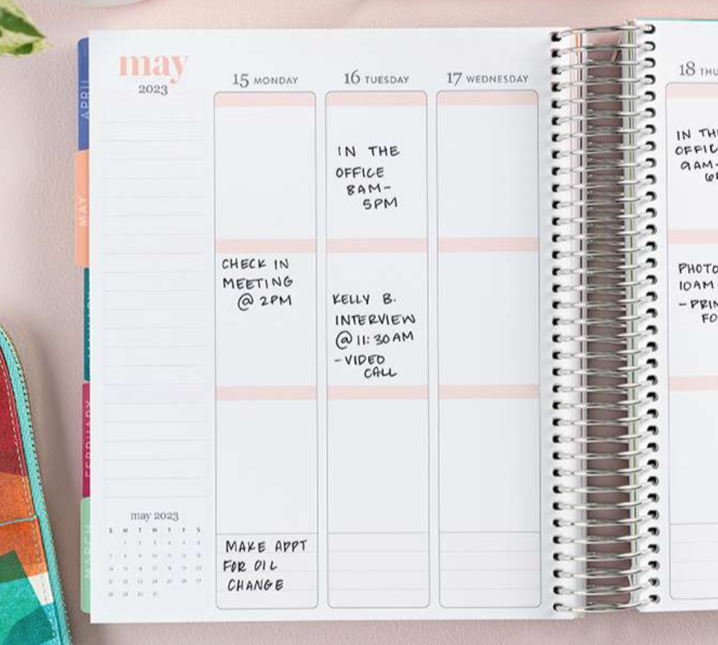 Erin Condren Life Planner 2023 opened to show the weekly planning view in May 2023