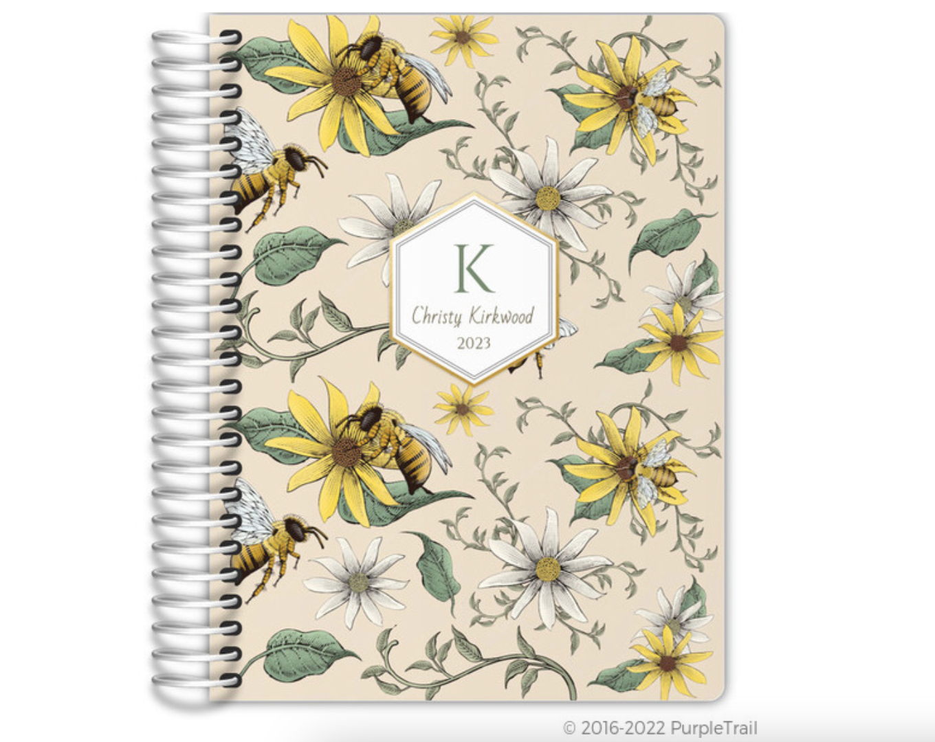 Spiral bound Purple Trail Daily Planner 2023 with yellow and green floral cover